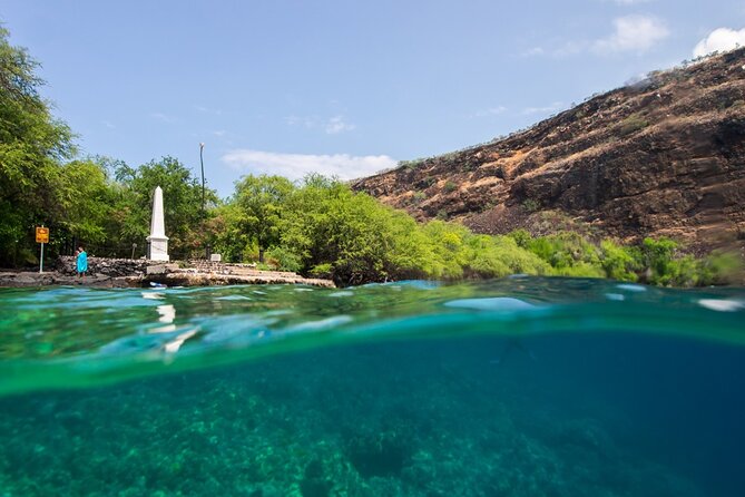 Kona Shore Excursion: Wild Dolphin Reefs Snorkel and Sea Caves - Snorkeling beside the Captain Cook Monument