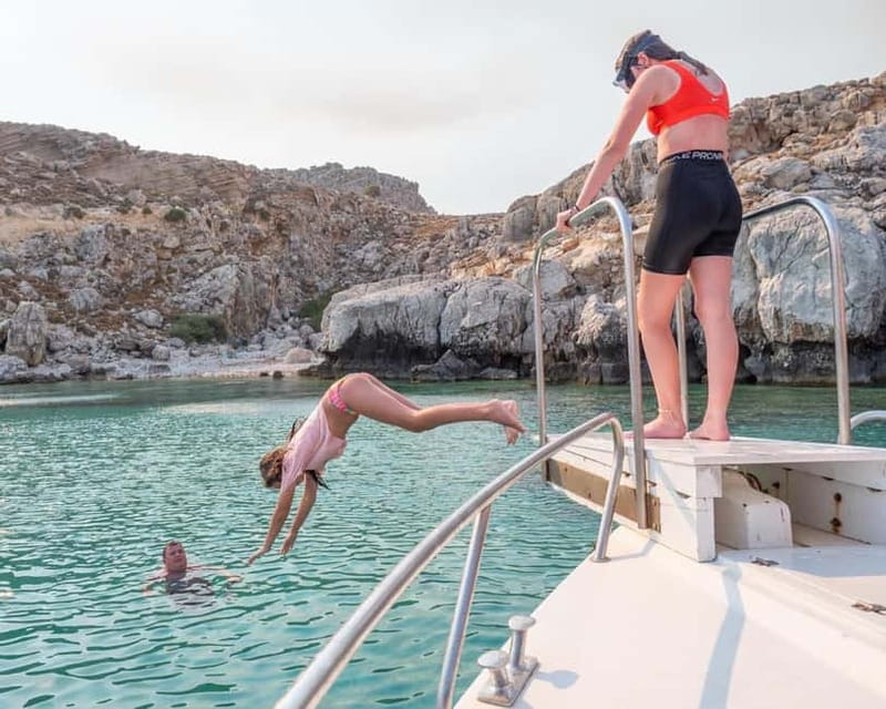 Lindos: Glass Bottom Boat Tour with Snorkeling - The Lindos Caves from the water
