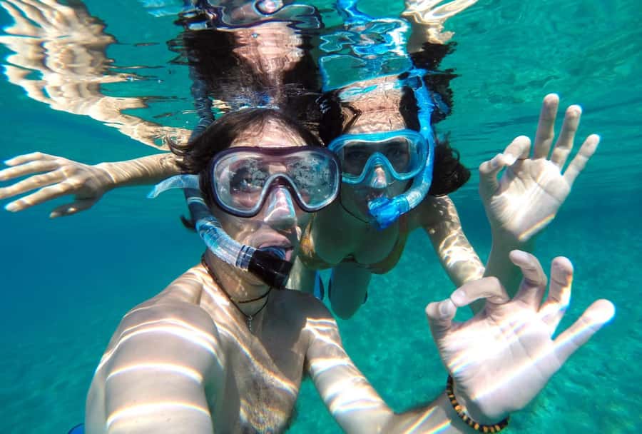 Matemwe: Mnemba Island Dolphin & Snorkeling Boat Trip - The sandbar, swimming, and fruit break