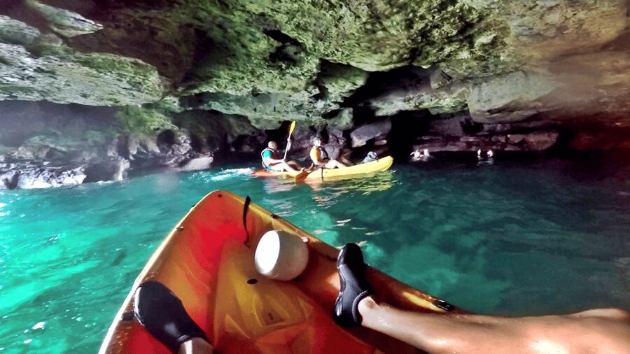 Mogán: Guided Kayak to Caves and Snorkeling Tour - Paddling below the white cliffs