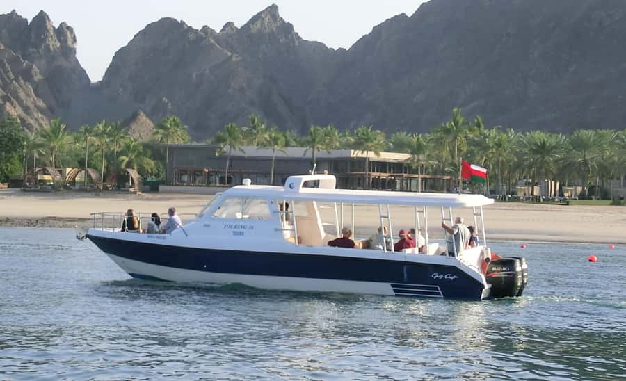 Muscat: Dolphin Watch & Snorkel Excursion - Snorkeling in a sheltered cove