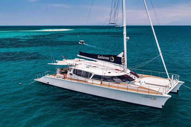 Outer Reef Mackay Cay Sail & Snorkel Adventure from Port Douglas - Snorkeling with crew in the water
