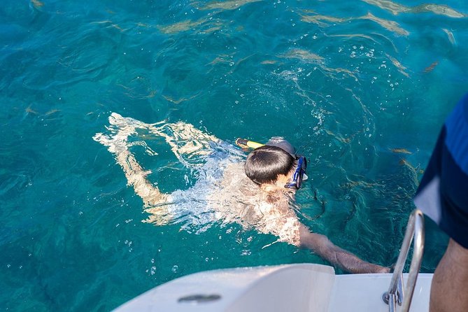 Santorini: Adventurous Catamaran Experience with Snorkeling - Lunch, wine and a slower stretch on board