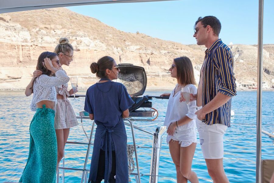Santorini Gold Catamaran Cruise with Snorkel, BBQ & Open Bar - Mesa Pigadia, the BBQ, and the longest swim