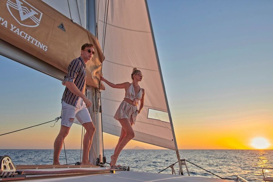 Santorini Gold Catamaran Cruise with Snorkel, BBQ & Open Bar - Sunset, music, and the ride back to Vlychada