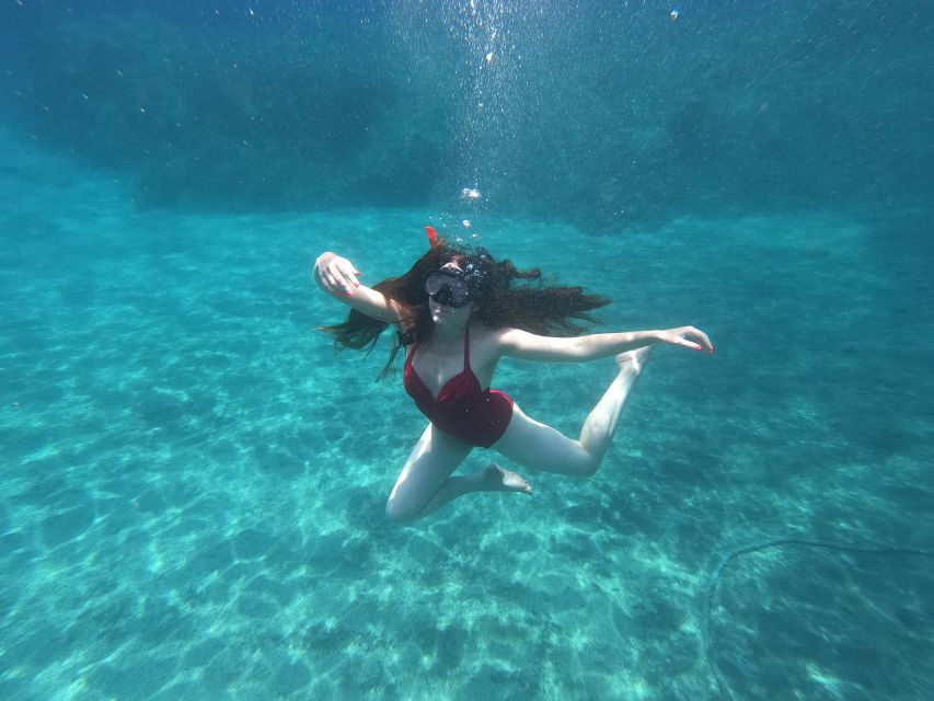 Santorini: Sea Caves Kayak Trip with Snorkeling and Picnic - Black Mountain and the volcanic south coast