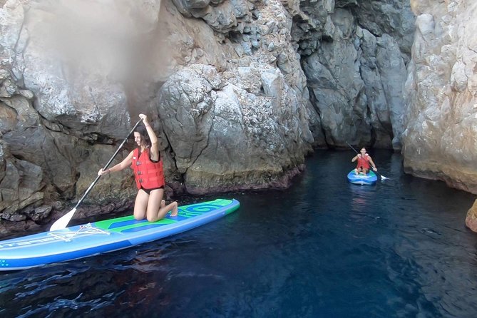 Santorini: Stand-Up Paddle and Snorkel Adventure - Paddling beside the cliff-lined coast