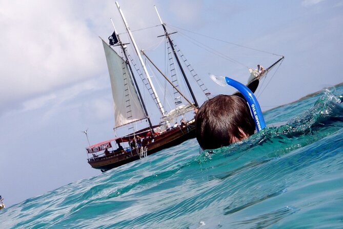 Set Sail in Aruba: Jolly Pirate Cruise with Snorkel Adventure - The Rope Swing Supplies the Big Finish