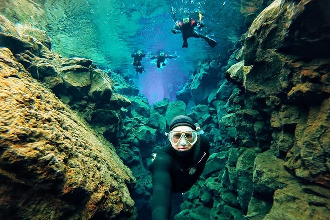Silfra Wetsuit Snorkeling - Meet on Location | Free Photos - Entering the fissure