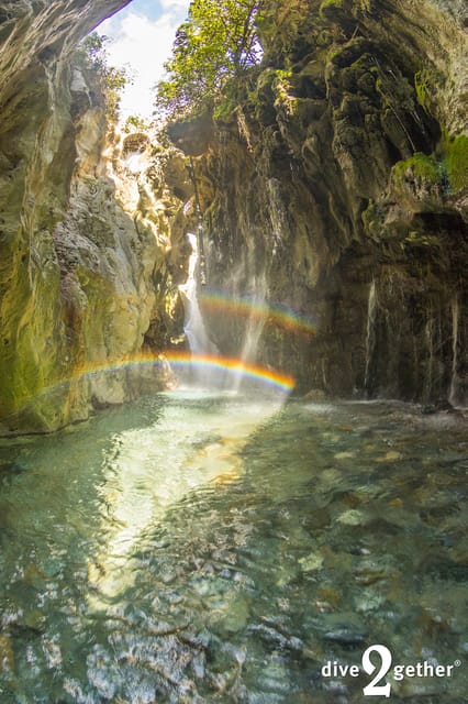Snorkel trip to the Kourtaliotiko Waterfalls Plakias - Putting on the wetsuit beside the river