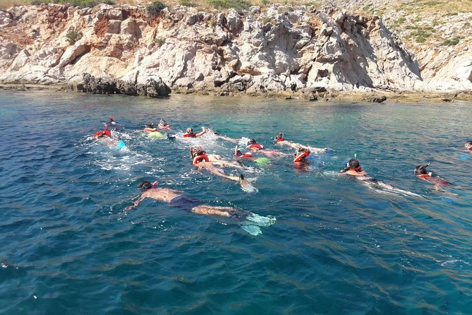 Snorkeling marine protected area Tavolara - Tavolara’s sea wall from the boat