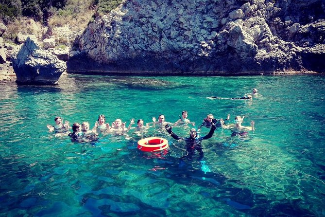 Snorkeling Tour Coast to Coast Taormina and Isola Bella - The first snorkeling stop, about 45 minutes