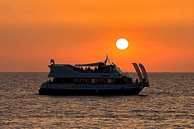 Sunset Beach Hopping Cruise, Cala Comte and Cala Bassa, SUP and snorkelling - The boat’s swimming stop: slides, SUP, and snorkelling