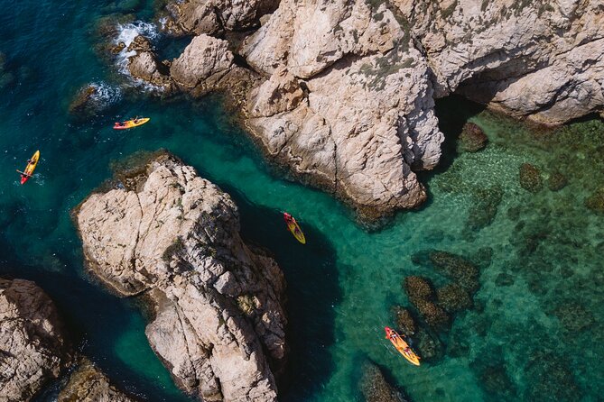 Tossa de Mar: Kayak & Snorkel Tour with Paella from Barcelona - Three hours among coves, cliffs, and sea caves