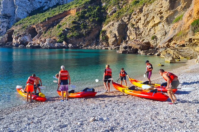Uncharted Caves & Snorkelling Heaven: Cala Granadella Kayak Tour - Cueva del Llop Marí and its rock colors