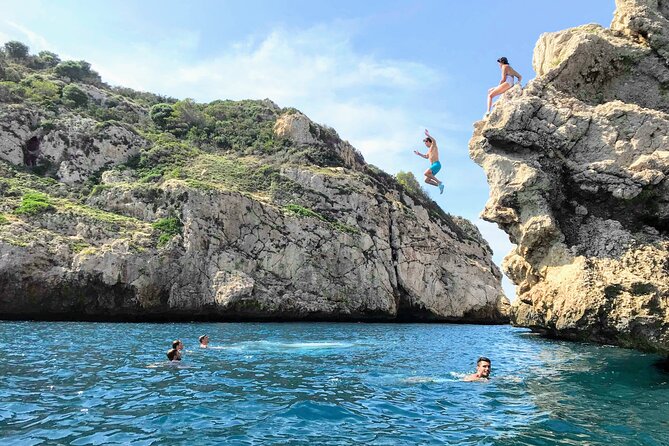 Uncharted Marine Reserve Cave, Snorkel & Cliff Jumping Kayak Tour - Re-entering the kayak is harder than it looks